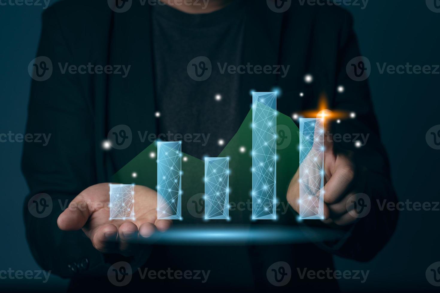 A business man touch the modern growth graph computer graphic light, planing and business concept photo