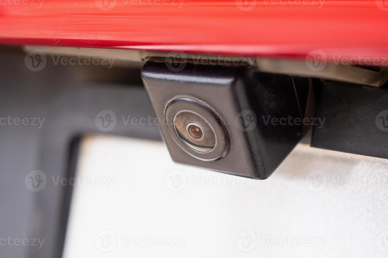 Red car rear view camera close up for parking assistance photo
