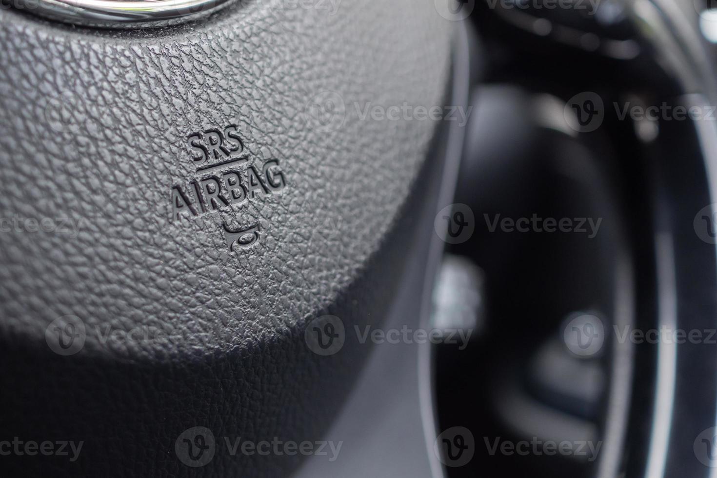 Safety airbag sign on car steering wheel with horn icon photo