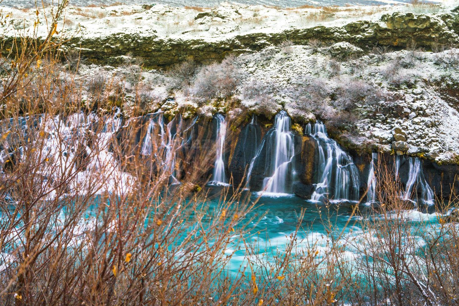 Hraunfossar, a waterfall formed by rivulets streaming over Hallmundarhraun, a lava field from volcano lying under the glacier Langjokull, and pour into the Hvita river, Iceland photo