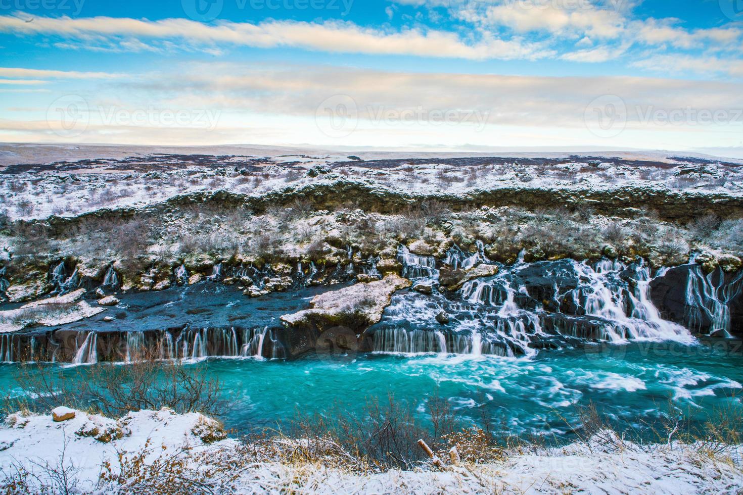 Hraunfossar, a waterfall formed by rivulets streaming over Hallmundarhraun, a lava field from volcano lying under the glacier Langjokull, and pour into the Hvita river, Iceland photo