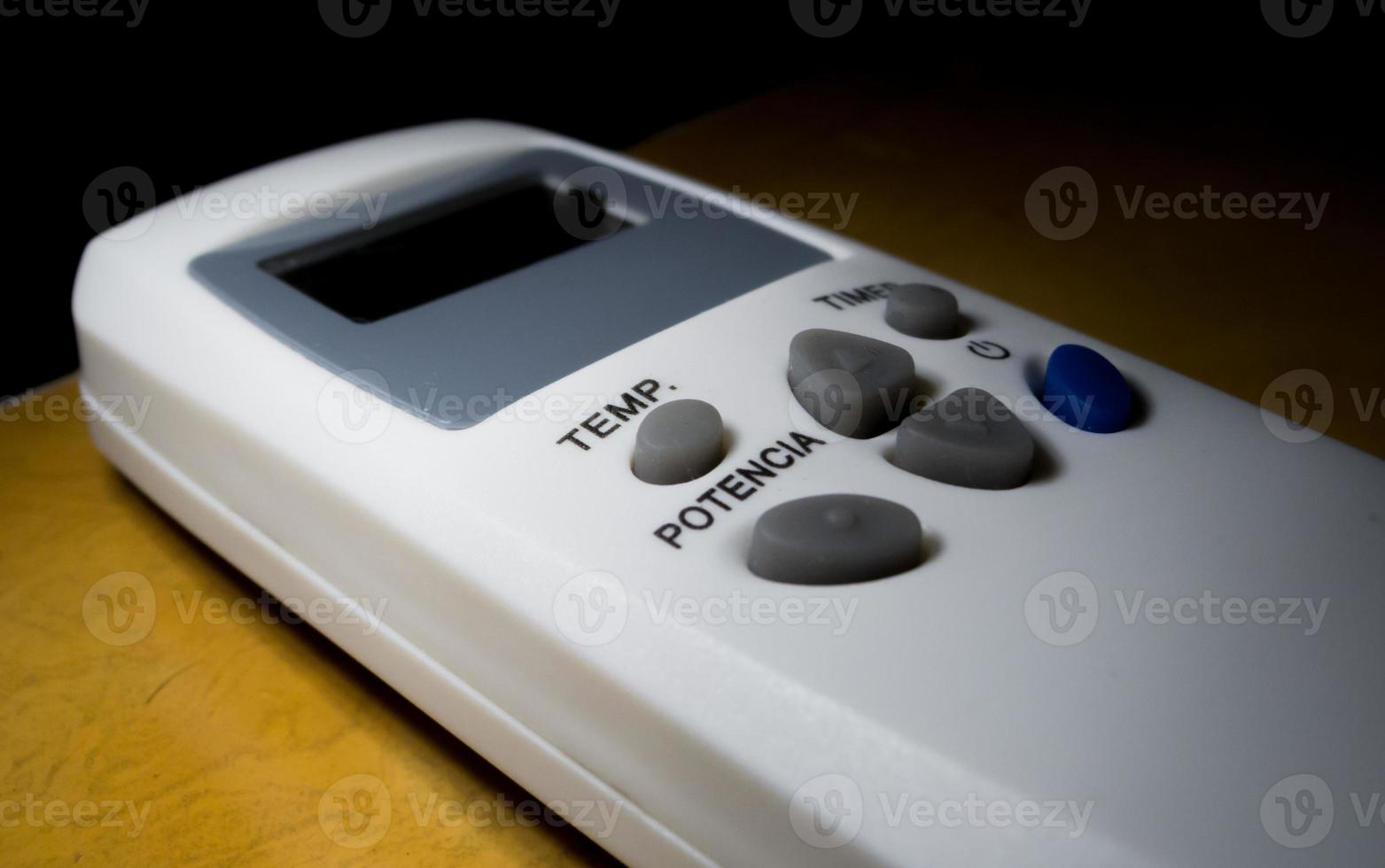Air conditioner remote control, side view, spanish writings photo