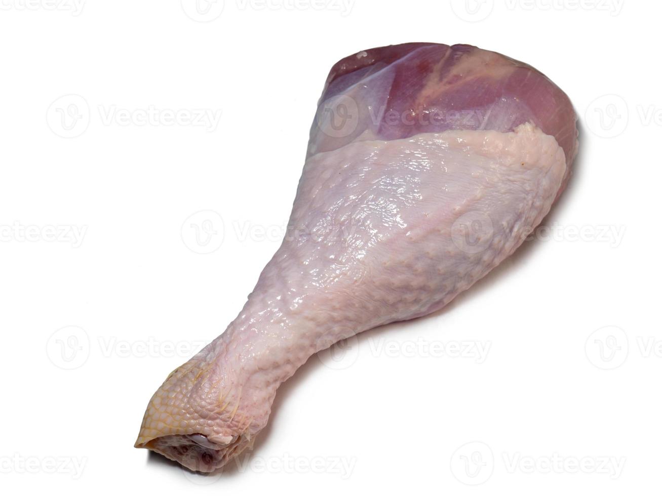 Turkey drumstick  in spices  on white background. Poultry meat. Turkey leg. Juicy meat is waiting to be cooked. photo