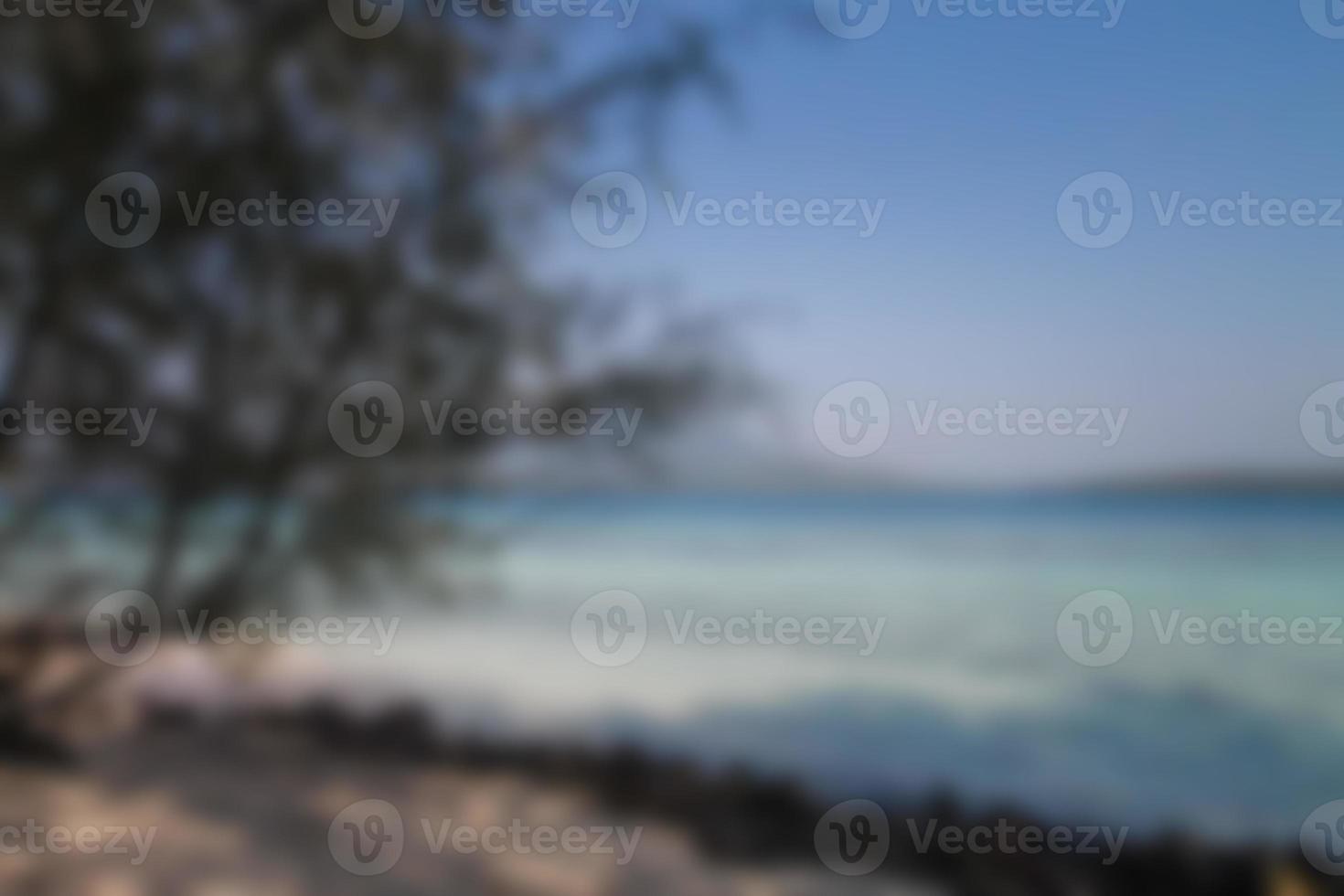 Blurred background, view tropical beach with sun light wave abstract background. Travel concept. photo