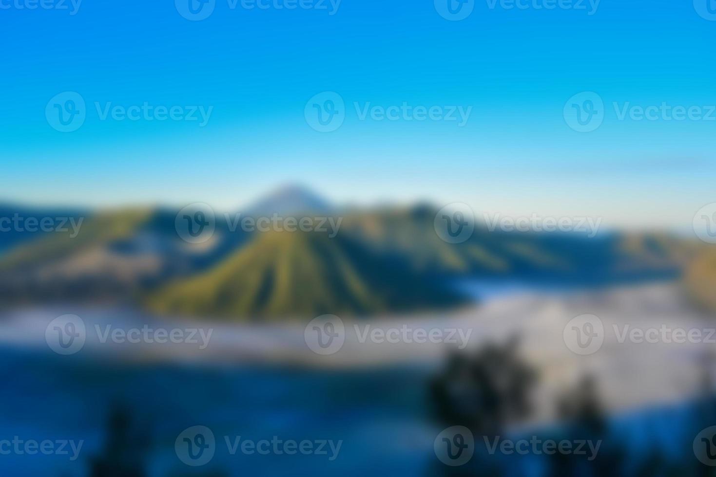 Blurred View of mount bromo at sunrise. Blur mountain background and nature landscape photo