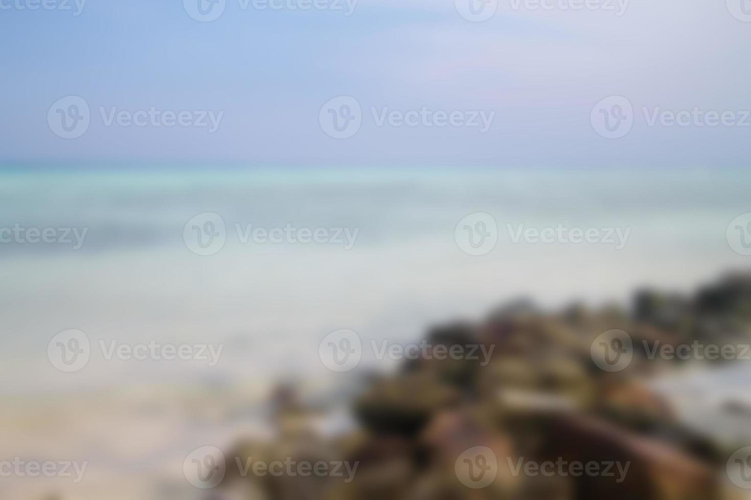 Blurred background, view tropical beach with sun light wave abstract background. Travel concept. photo
