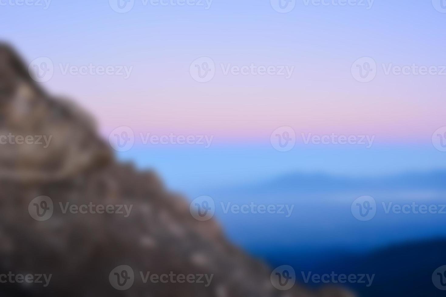 Blurred landscape blue sky with clouds, beautiful fantasy pastel colorful landscape background, gradient sky, sunrise with mountains in distant photo