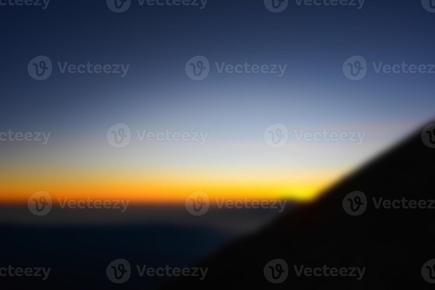 Blurred landscape blue sky with clouds, beautiful fantasy pastel colorful landscape background, gradient sky, sunrise with mountains in distant photo