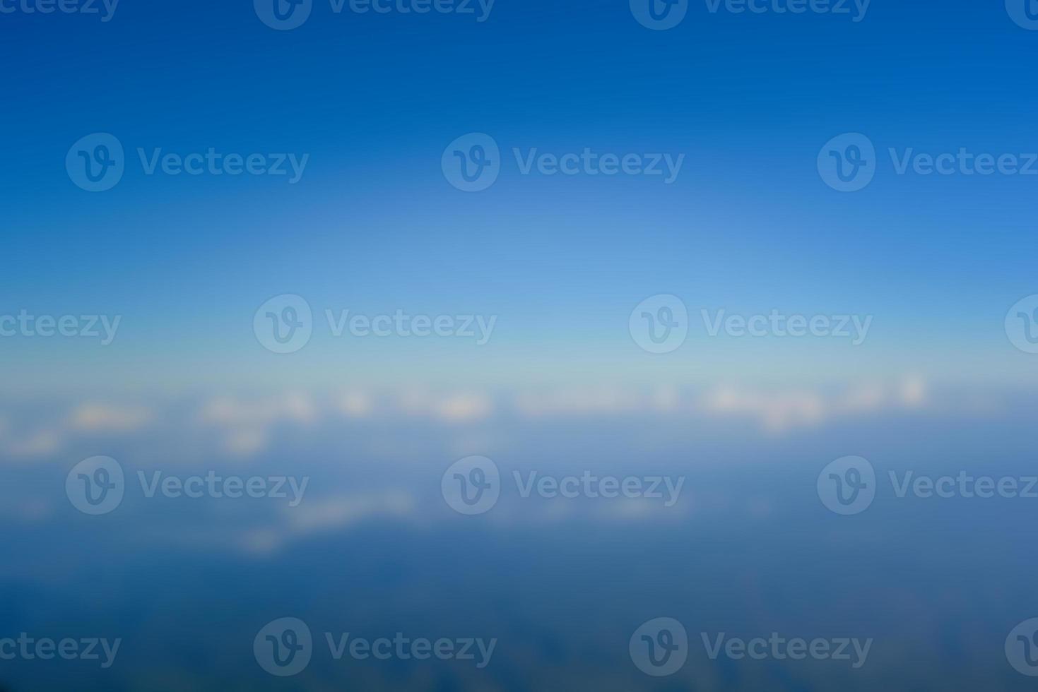Blurred landscape blue sky with clouds, beautiful fantasy pastel colorful landscape background, gradient sky, sunrise with mountains in distant photo