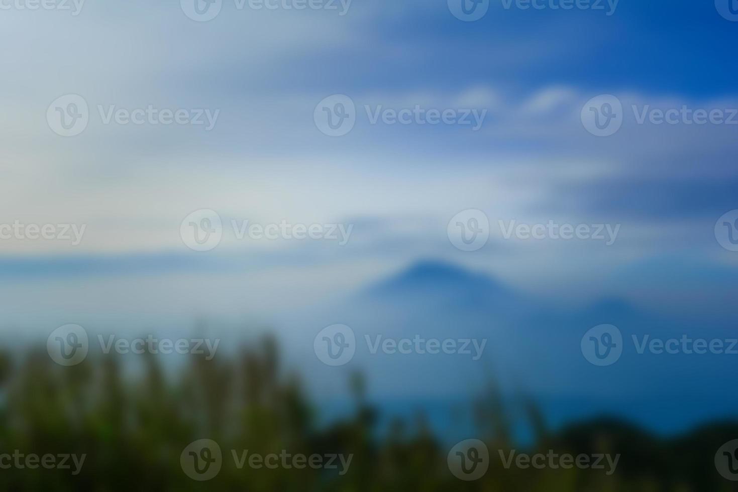 Blurred landscape blue sky with clouds, beautiful fantasy pastel colorful landscape background, gradient sky, sunrise with mountains in distant photo