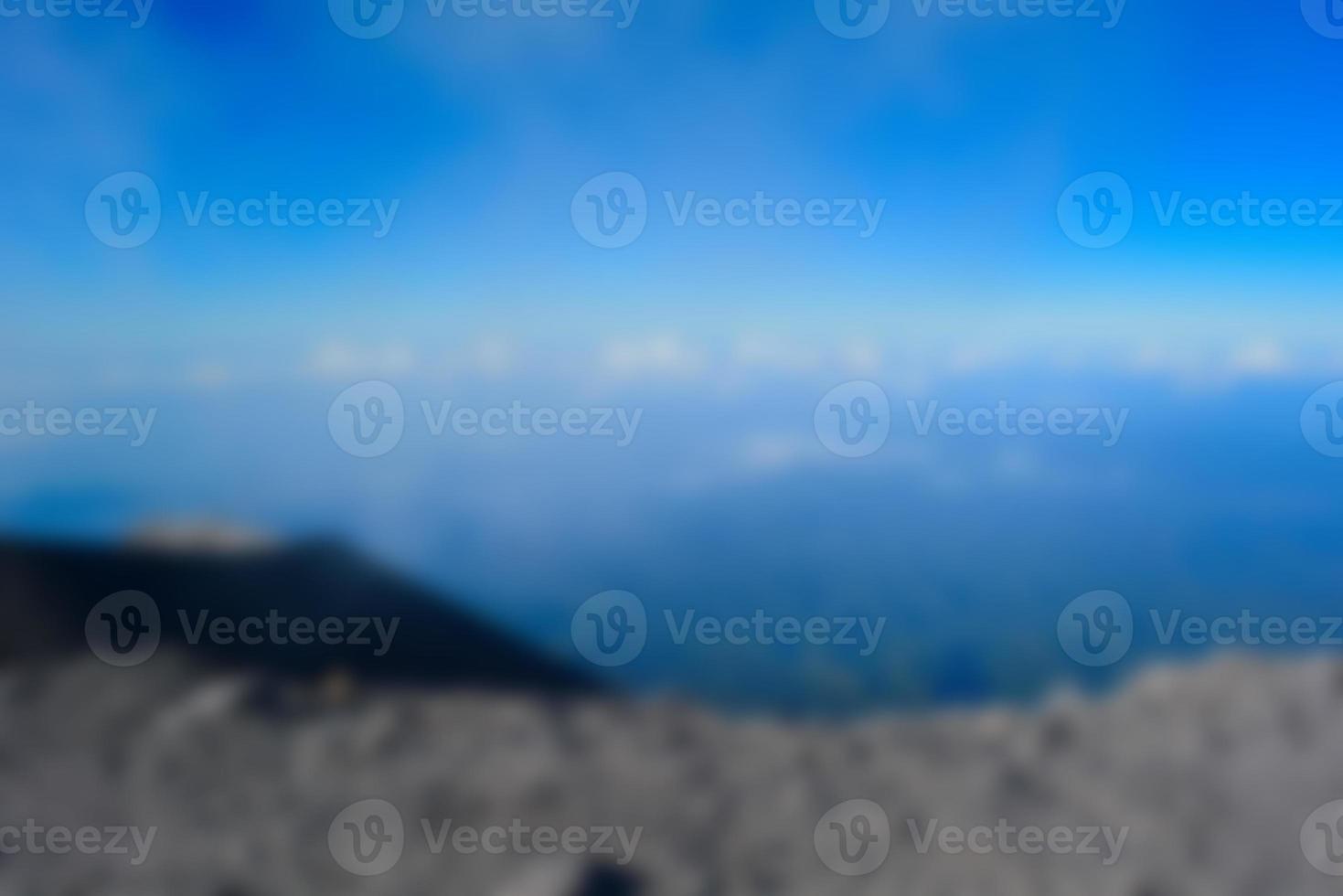 Blurred landscape blue sky with clouds, beautiful fantasy pastel colorful landscape background, gradient sky, sunrise with mountains in distant photo