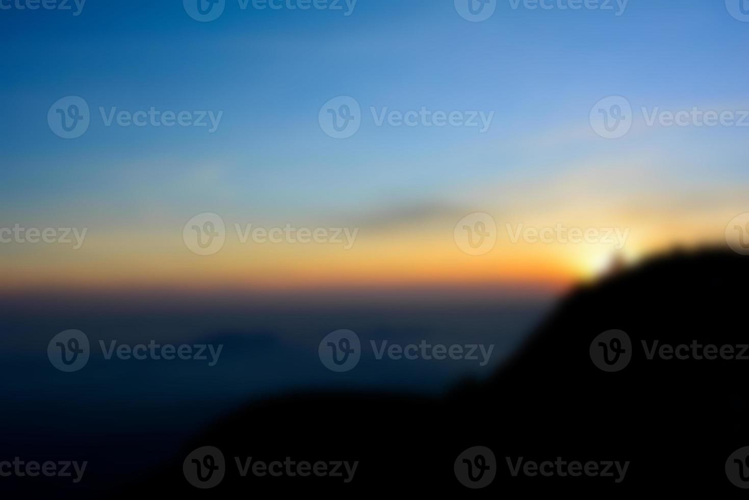 Blurred landscape blue sky with clouds, beautiful fantasy pastel colorful landscape background, gradient sky, sunrise with mountains in distant photo