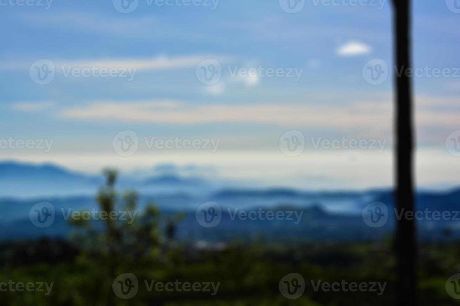 Blurred landscape blue sky with clouds, beautiful fantasy pastel colorful landscape background, gradient sky, sunrise with mountains in distant photo