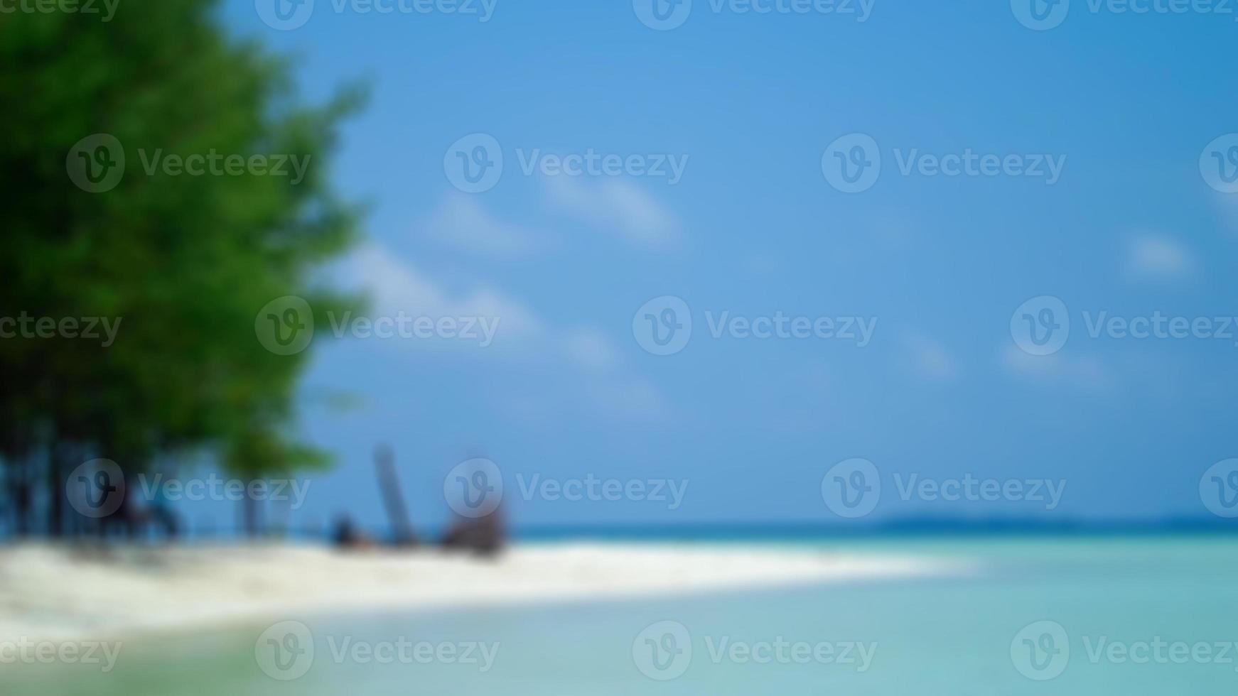 Blurred background, view tropical beach with sun light wave abstract background. Travel concept. photo