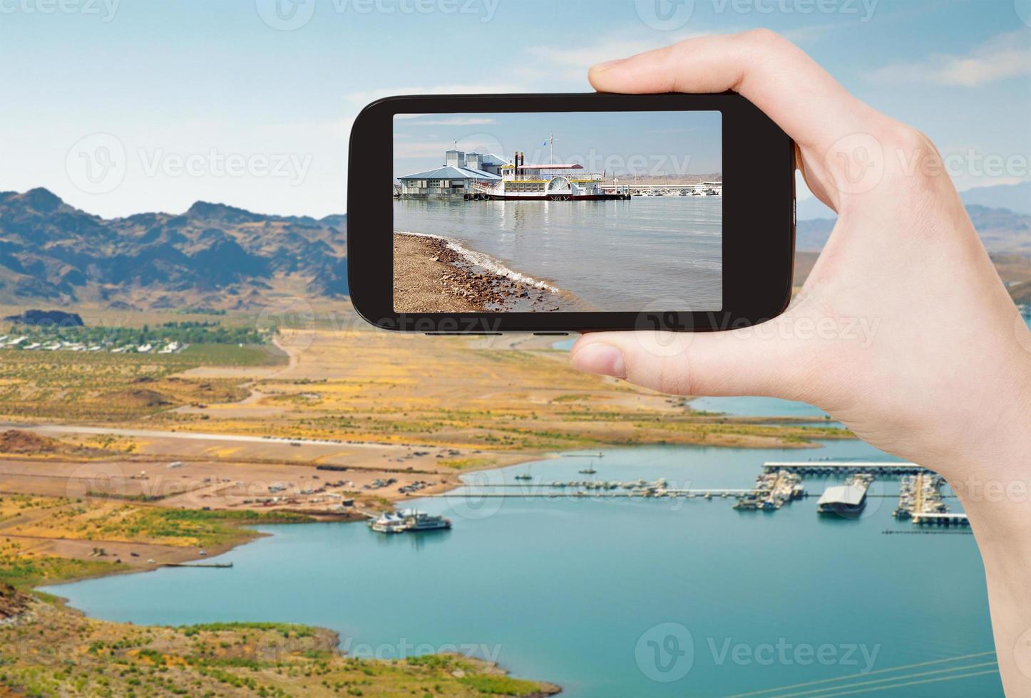 tourist taking photo of Boulder Beach on Lake Mead