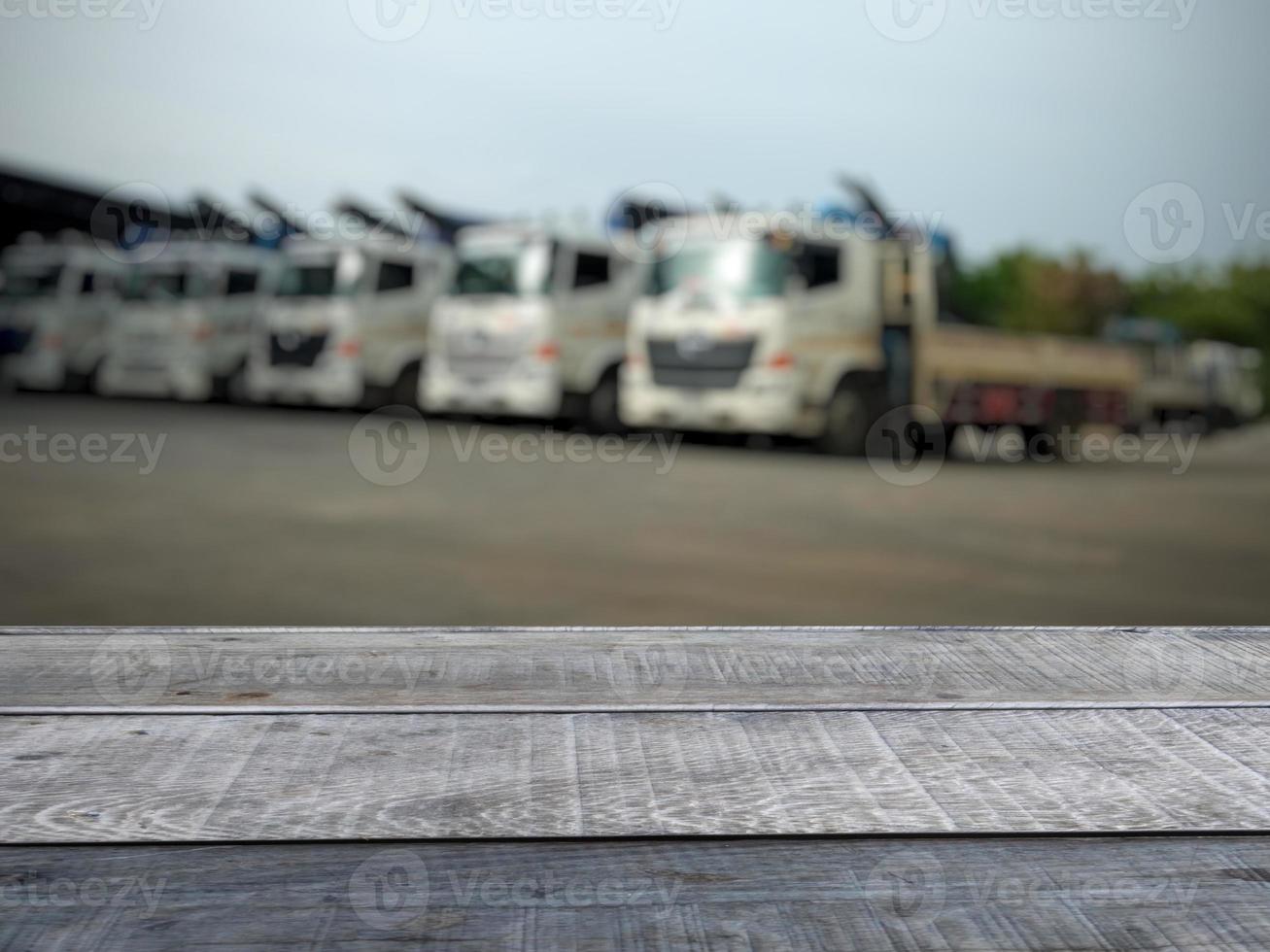 Old wooden table shelf, truck blur background. photo