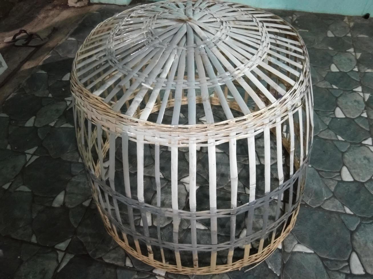 traditional chicken cage made of woven bamboo photo