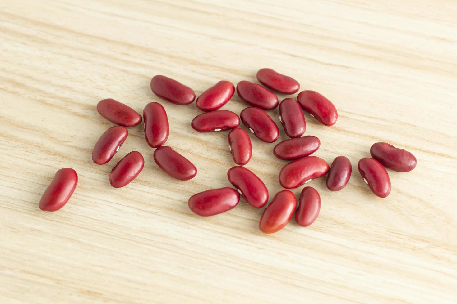 red kidney beans on wooden background, top view, flat lay, top-down, selective focus.copy space. photo