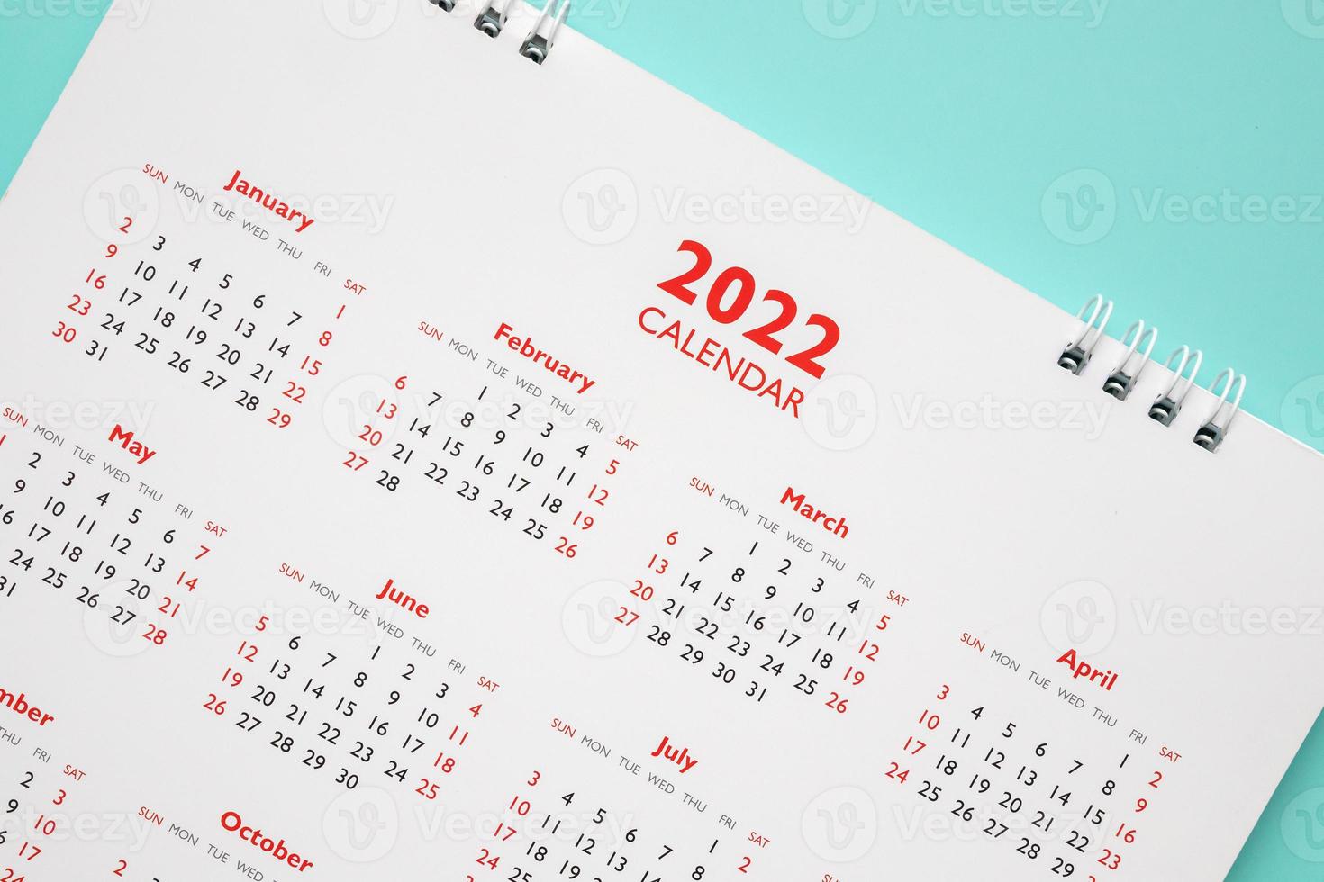 2022 calendar page on blue background business planning appointment meeting concept photo