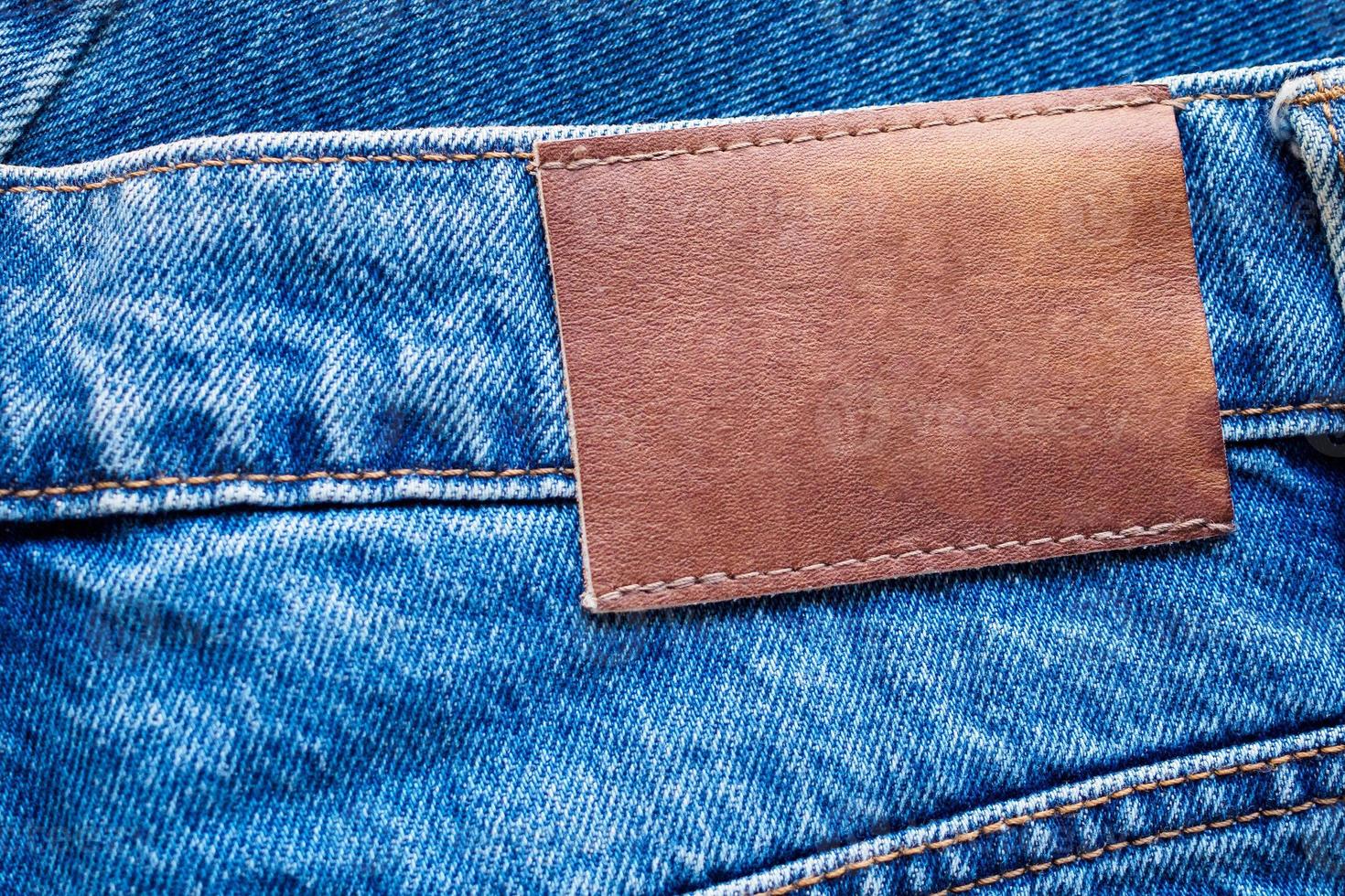 Blue denim jeans leather label texture background photo