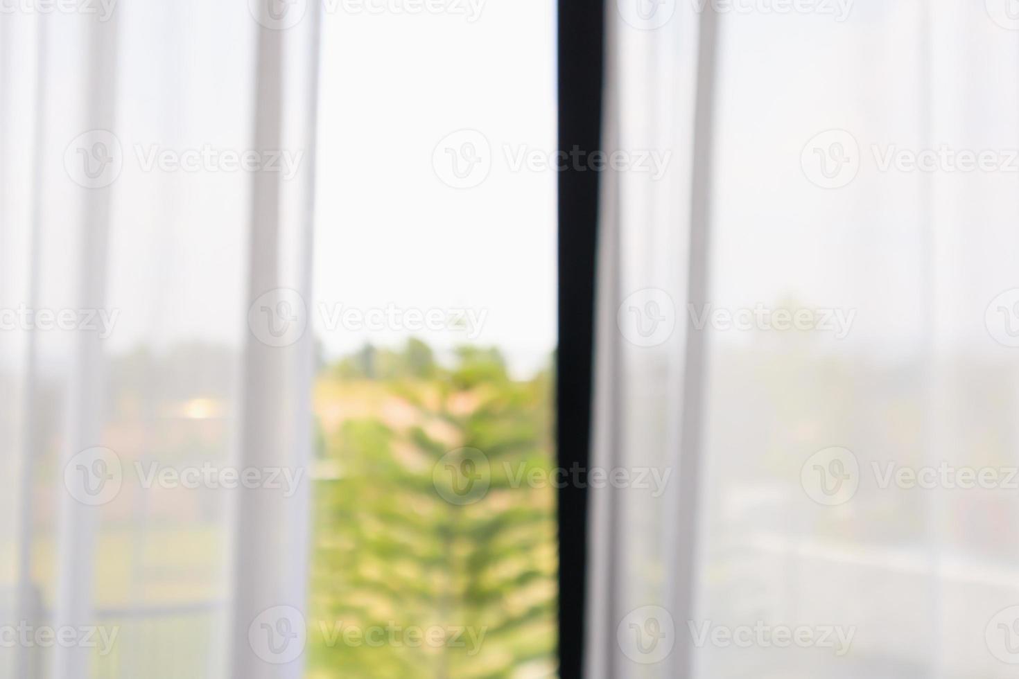 window curtain with green garden abstract blur background photo