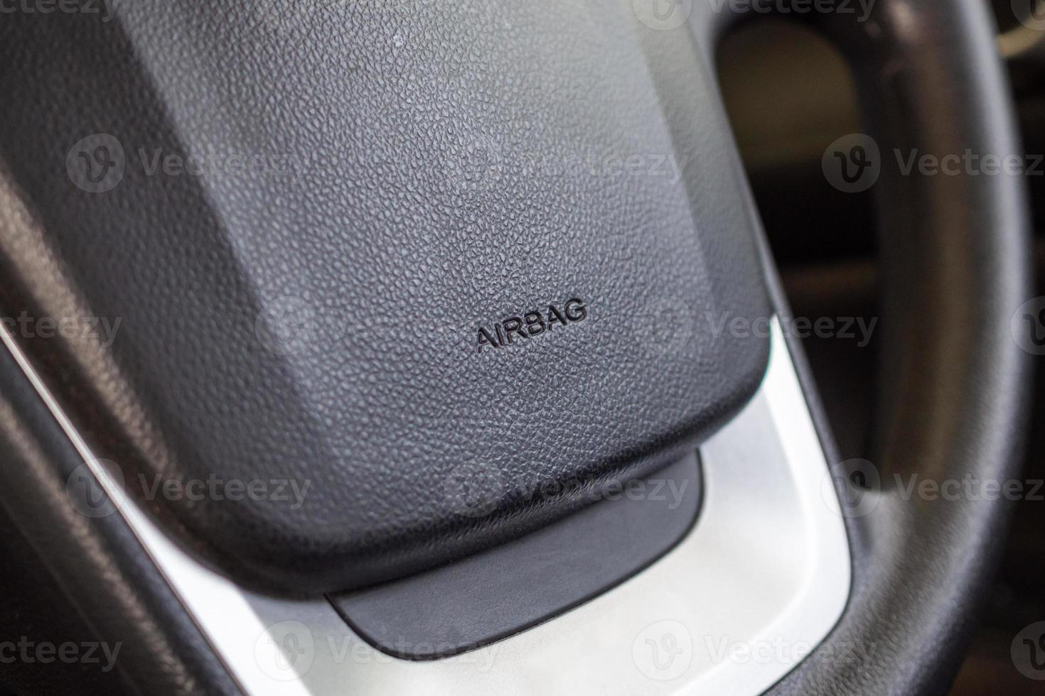 Safety airbag sign on car steering wheel photo