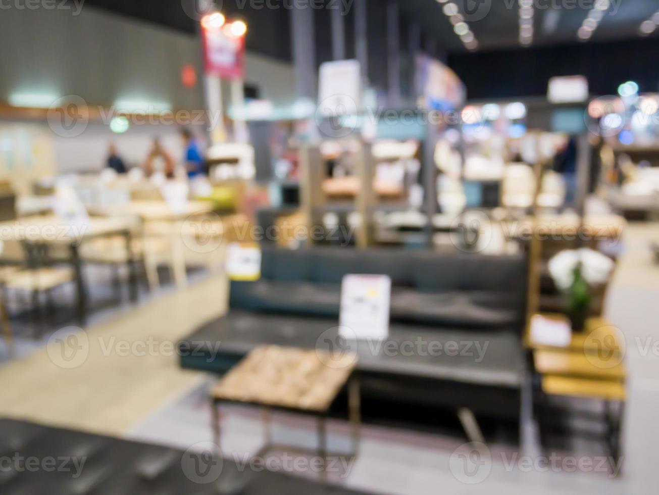Abstract blur sofa in furniture showroom store interior with bokeh light background for montage product display photo