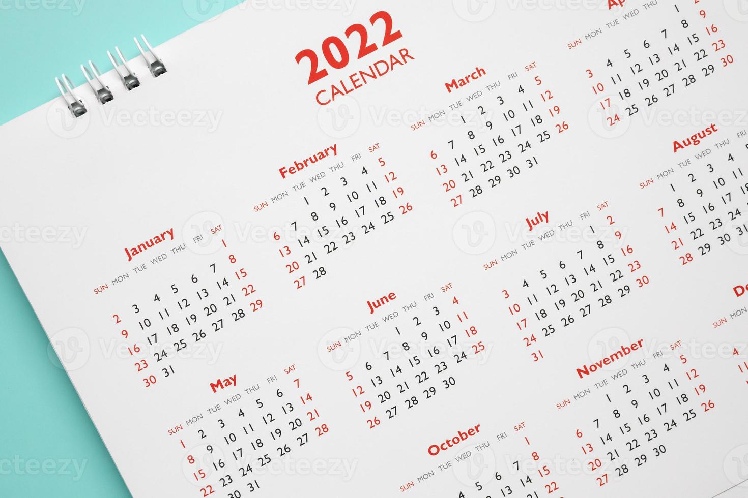 2022 calendar page on blue background business planning appointment meeting concept photo