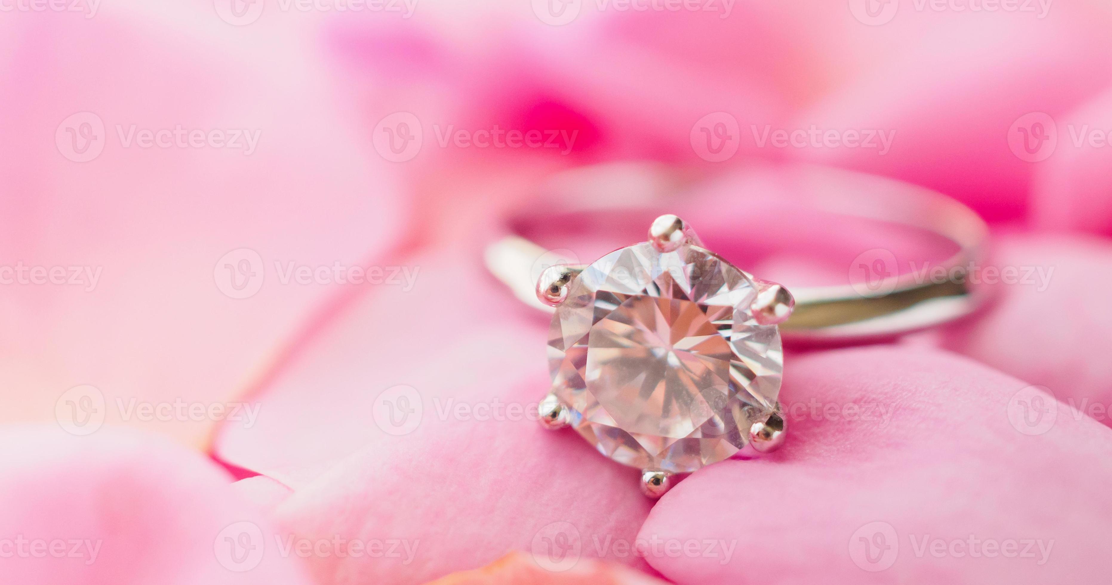 Jewelry diamond ring on beautiful pink rose petal background 12601813 Stock Photo at Vecteezy