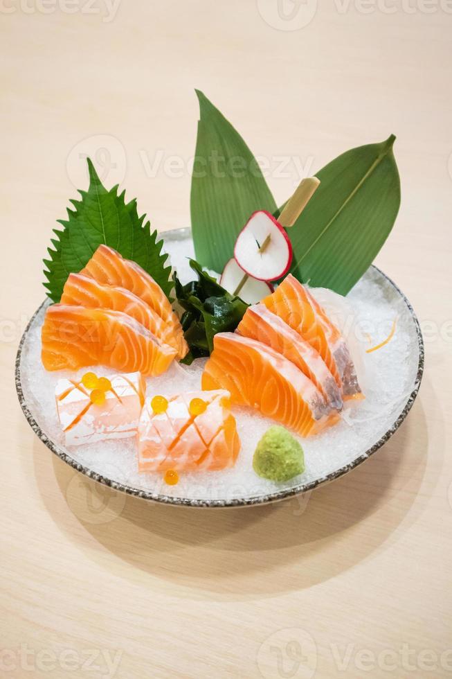 Fresh salmon slice sashimi serve on ice with wasabi Japanese style photo