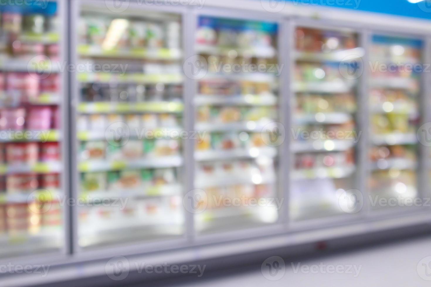 supermarket commercial refrigerators freezer showing frozen foods abstract blur background photo