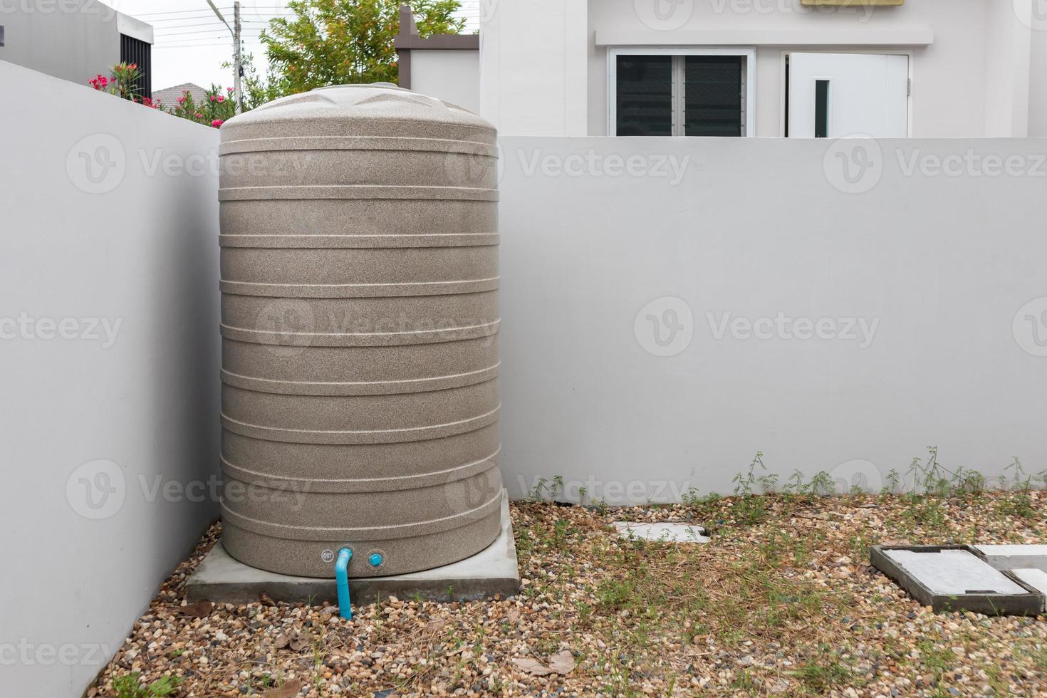 Water storage tank outside the house photo