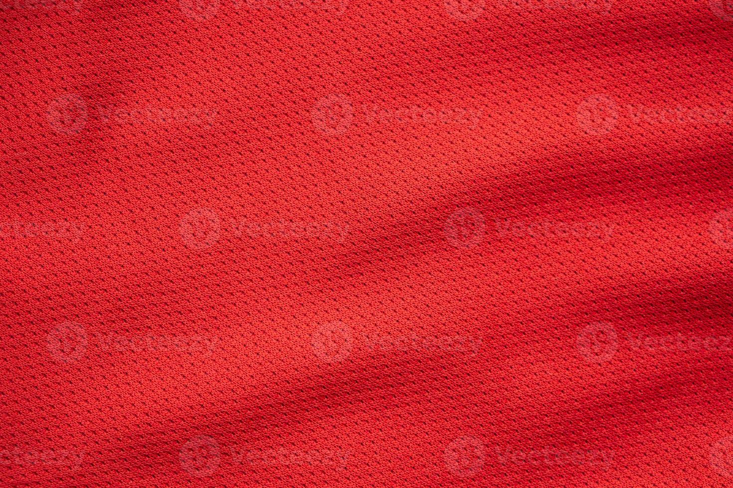 Red sports clothing fabric football jersey texture close up photo