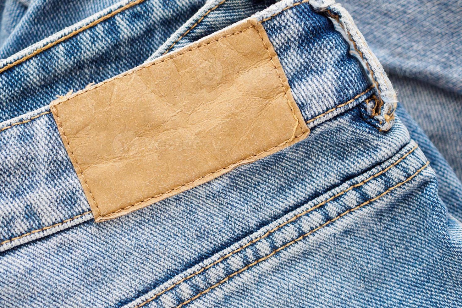 Fondo de textura de etiqueta de cuero de jeans azul foto