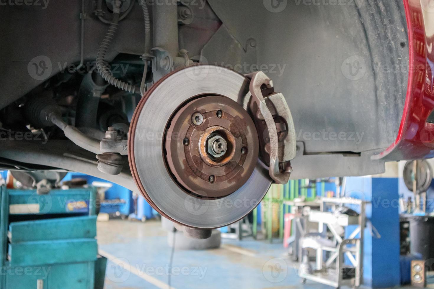 Close up disc brake at car service workshop photo