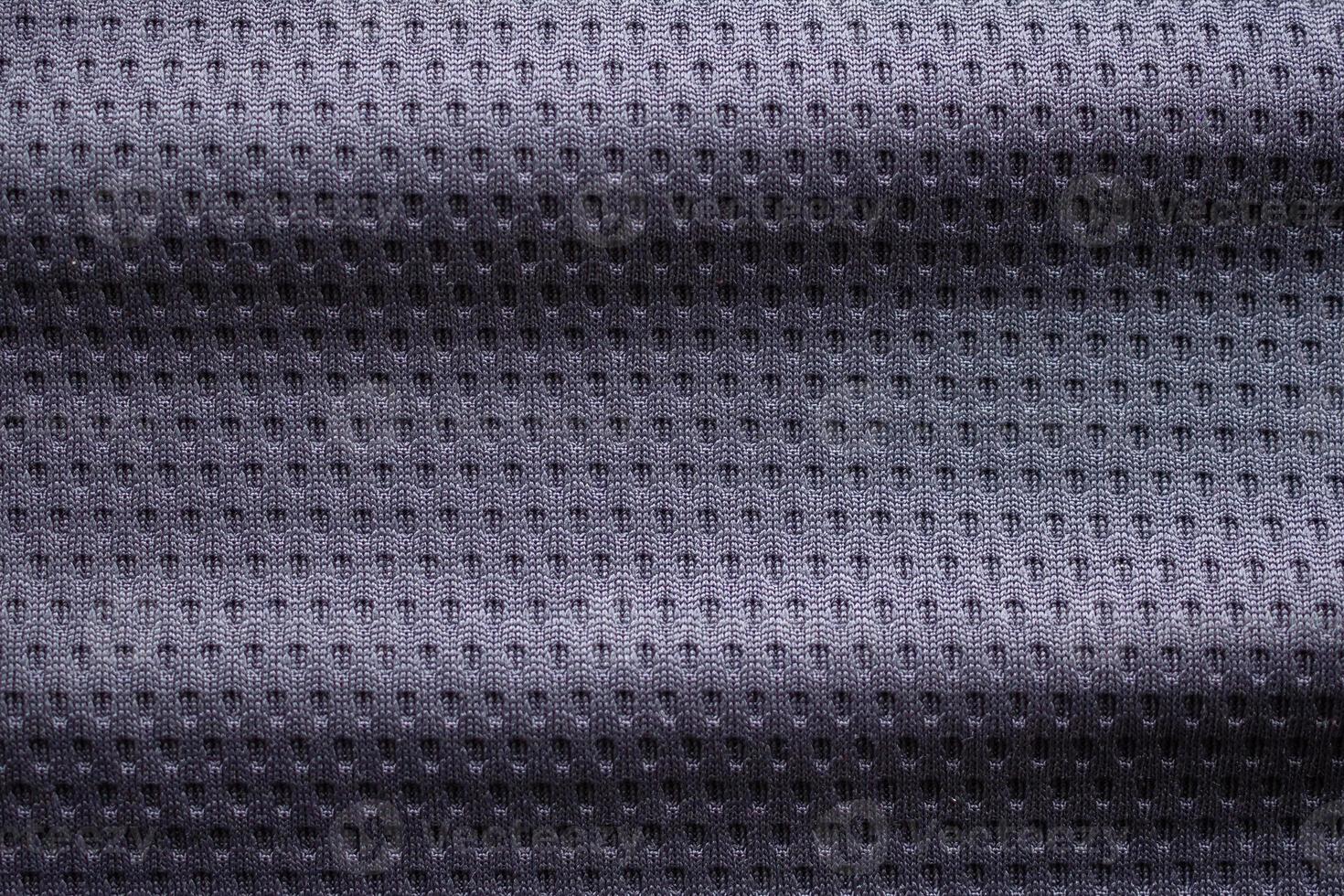 Gray fabric sport clothing football jersey with air mesh texture background photo