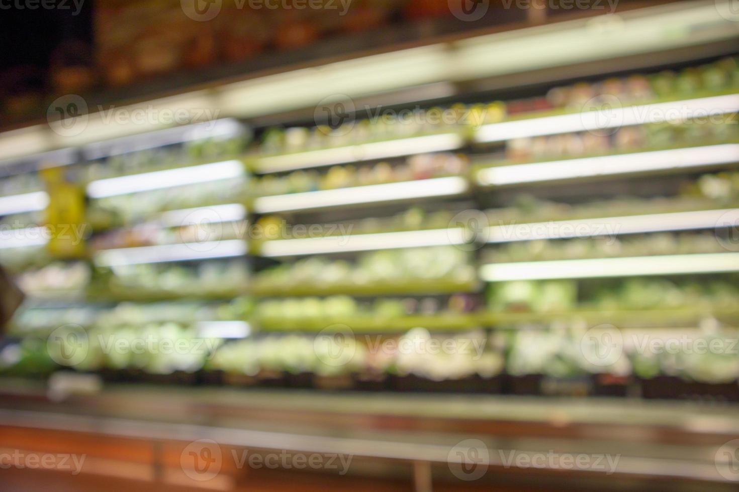 abstract blur organic fresh fruits and vegetable on grocery shelves in supermarket store defocused bokeh light background photo