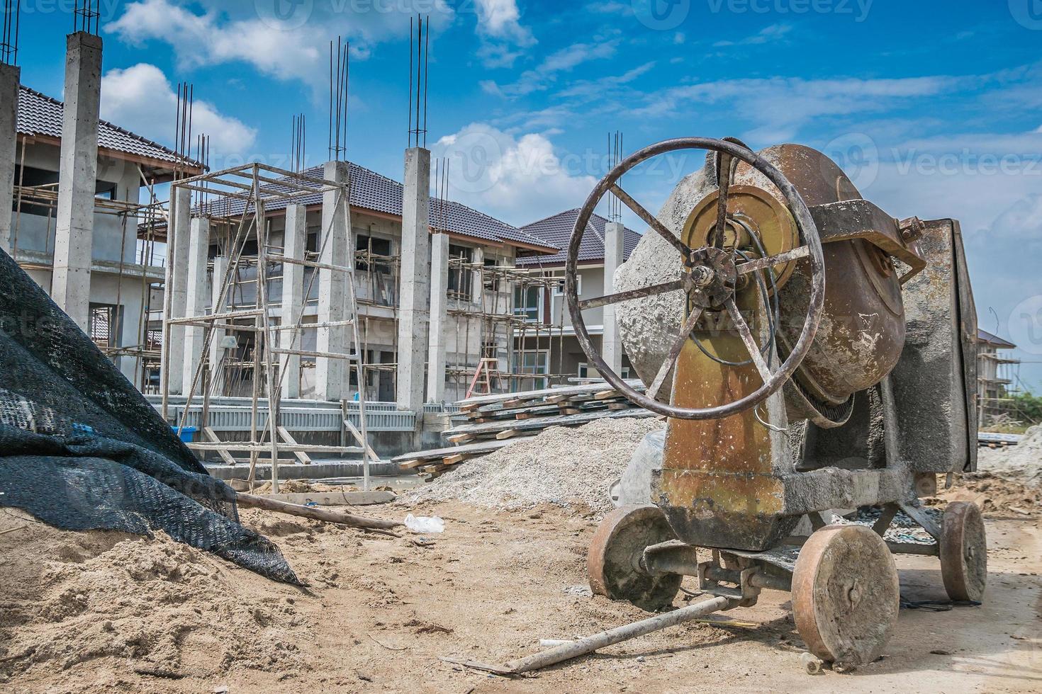 cement concrete mixer machine at new house building construction site photo