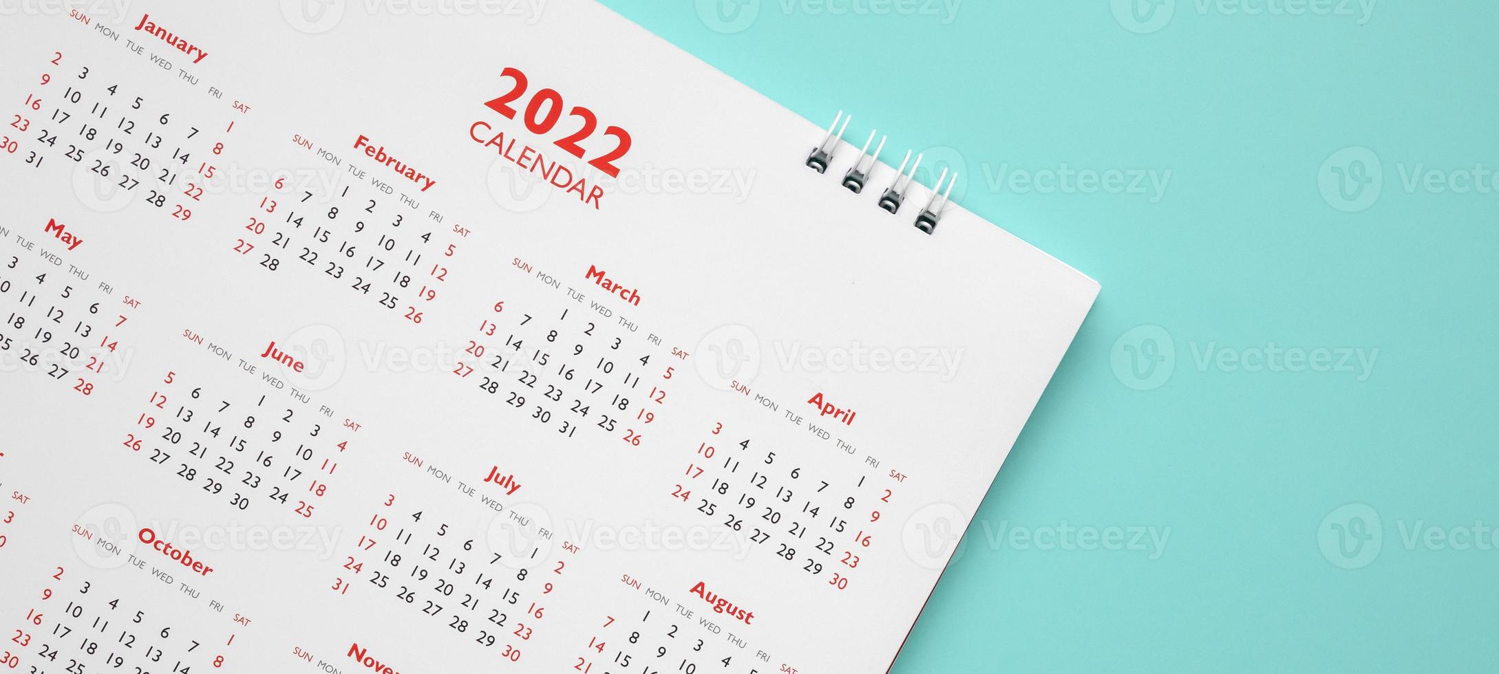 2022 calendar page on blue background business planning appointment meeting concept photo