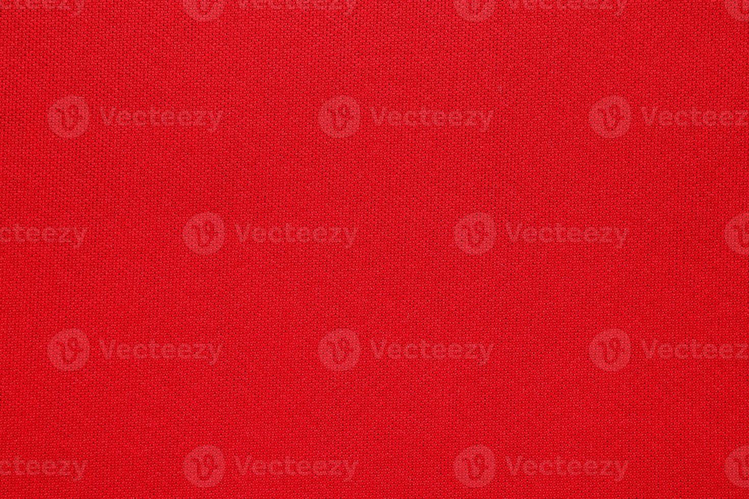 Red fabric texture background close up photo