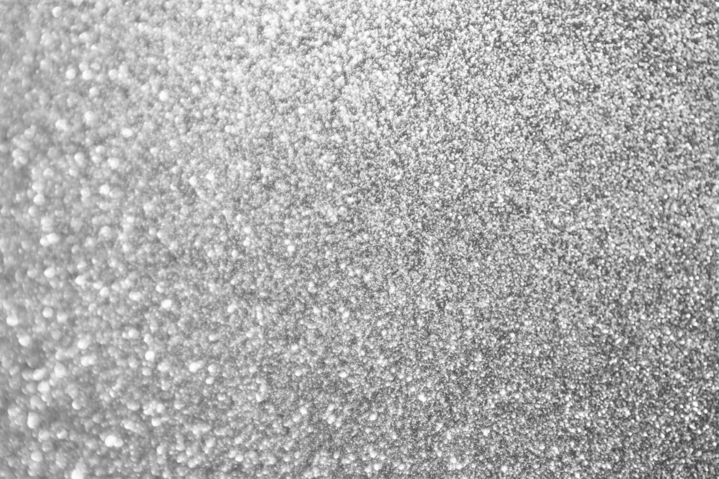 Abstract blur silver glitter sparkle defocused bokeh light background photo