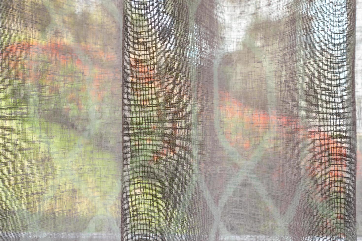 Abstract window curtain with flower garden closeup background photo