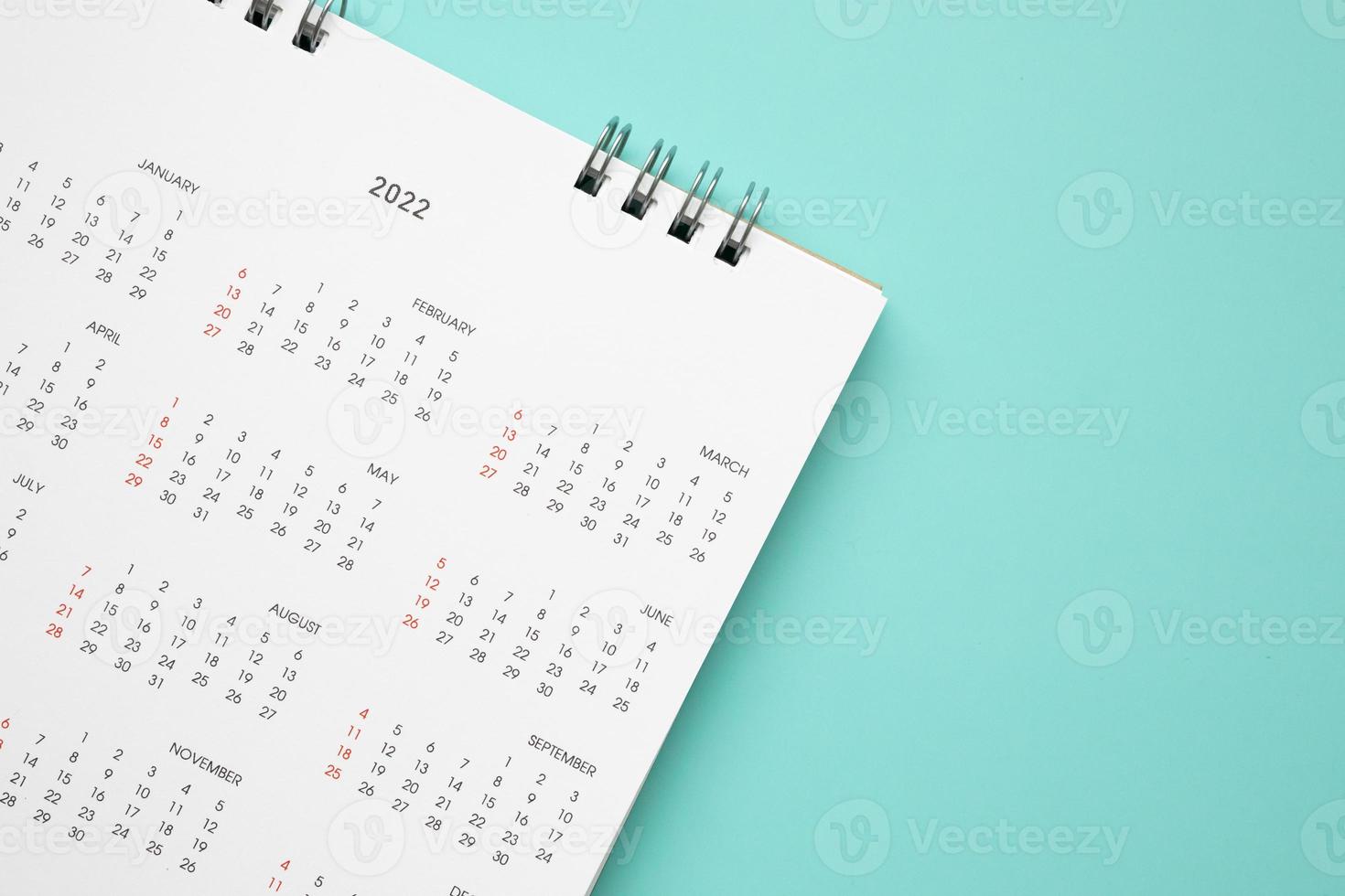 página de calendario 2022 sobre fondo azul concepto de reunión de cita de planificación empresarial foto