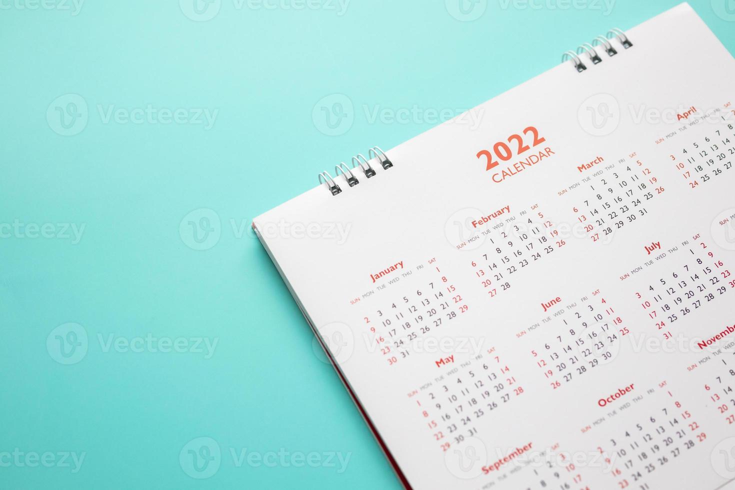 2022 calendar page on blue background business planning appointment meeting concept photo