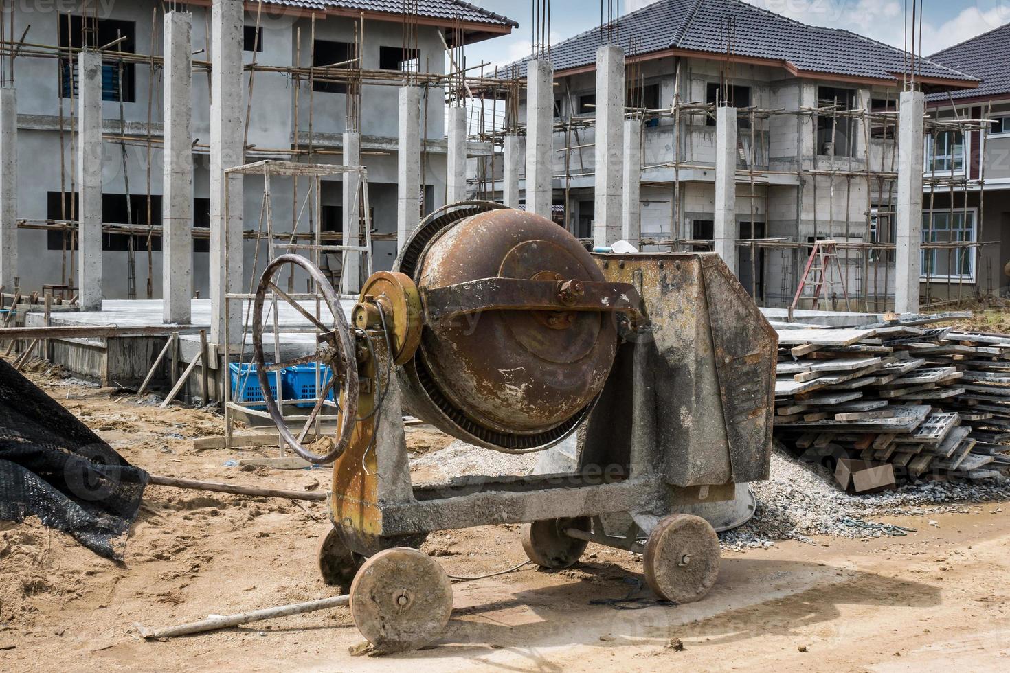 cement concrete mixer machine at new house building construction site photo