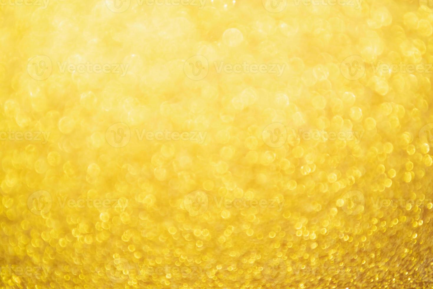 Abstract Gold glitter festive Christmas texture background blur with bokeh light photo