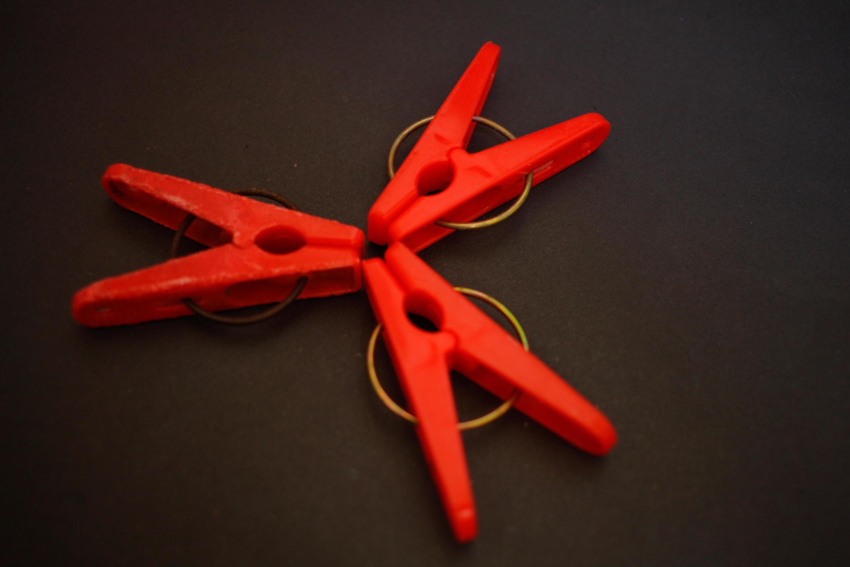 Portrait of a red clothes pin, can be used anytime and anywhere