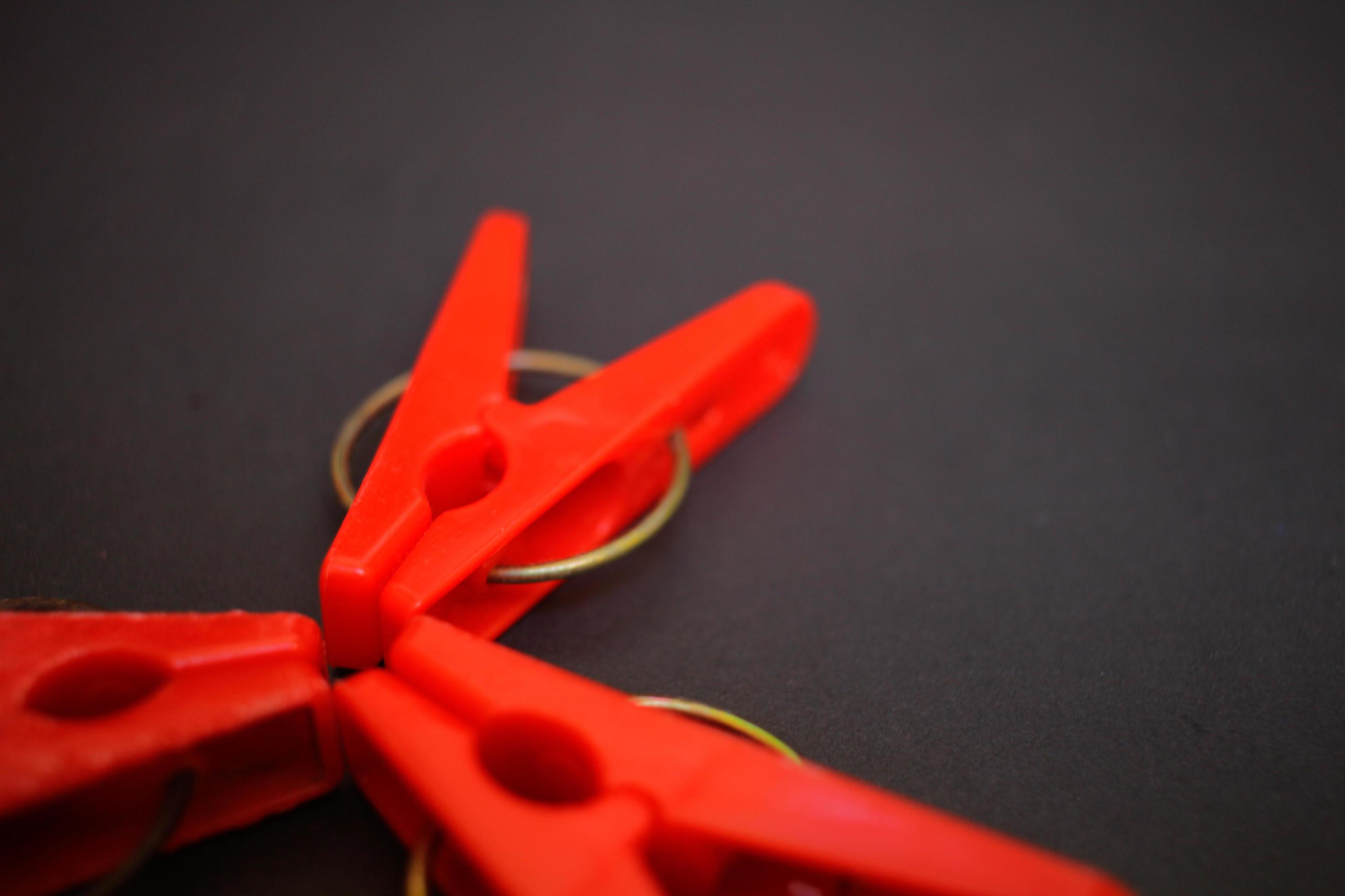 Portrait of a red clothes pin, can be used anytime and anywhere