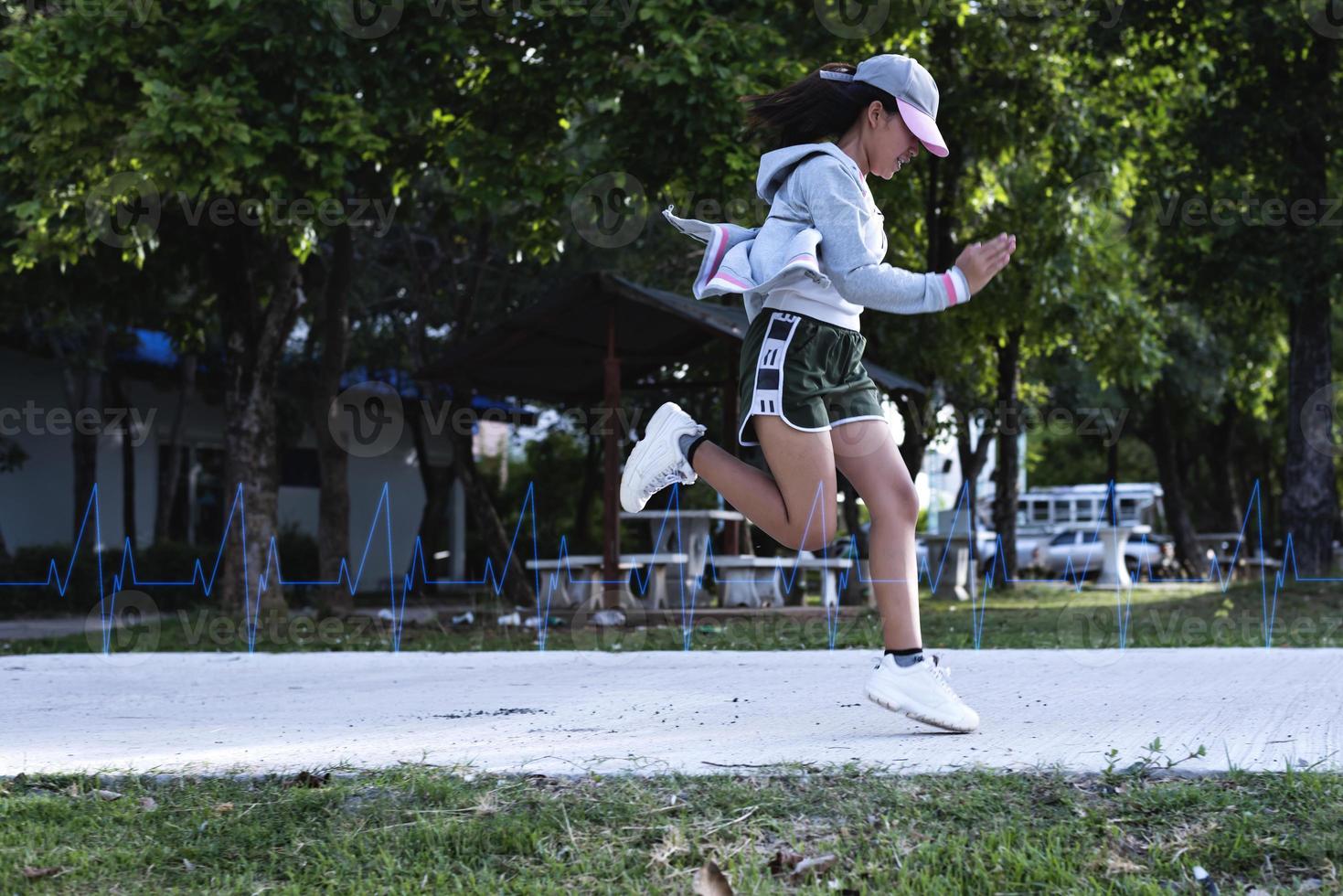 Women are jogging to maintain a healthy body. Technological concepts of running for good health. photo