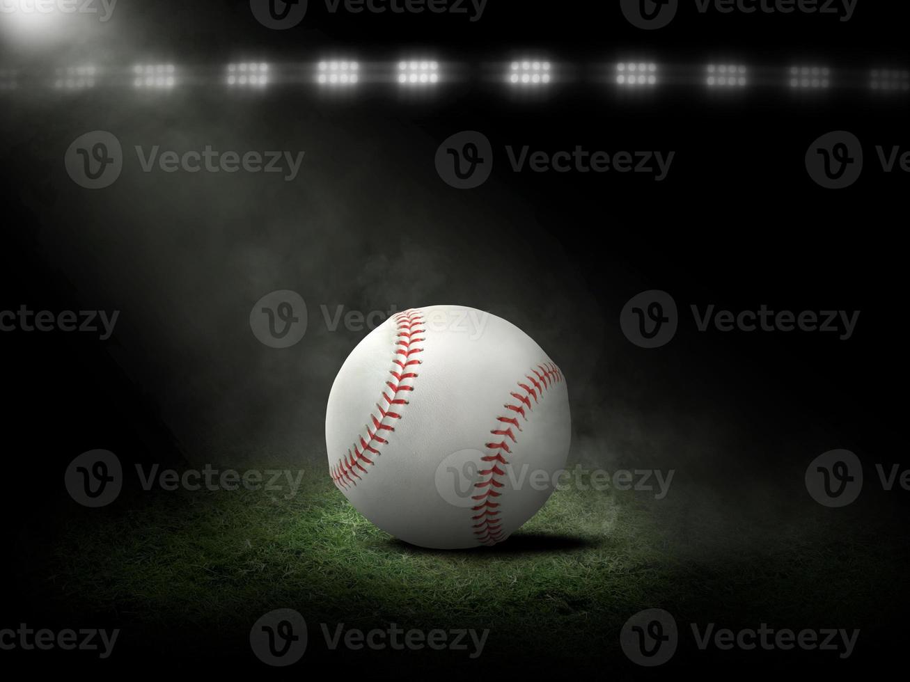 Baseball at night under stadium lights photo